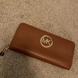 Light brown and gold Michael Kors zip wallet